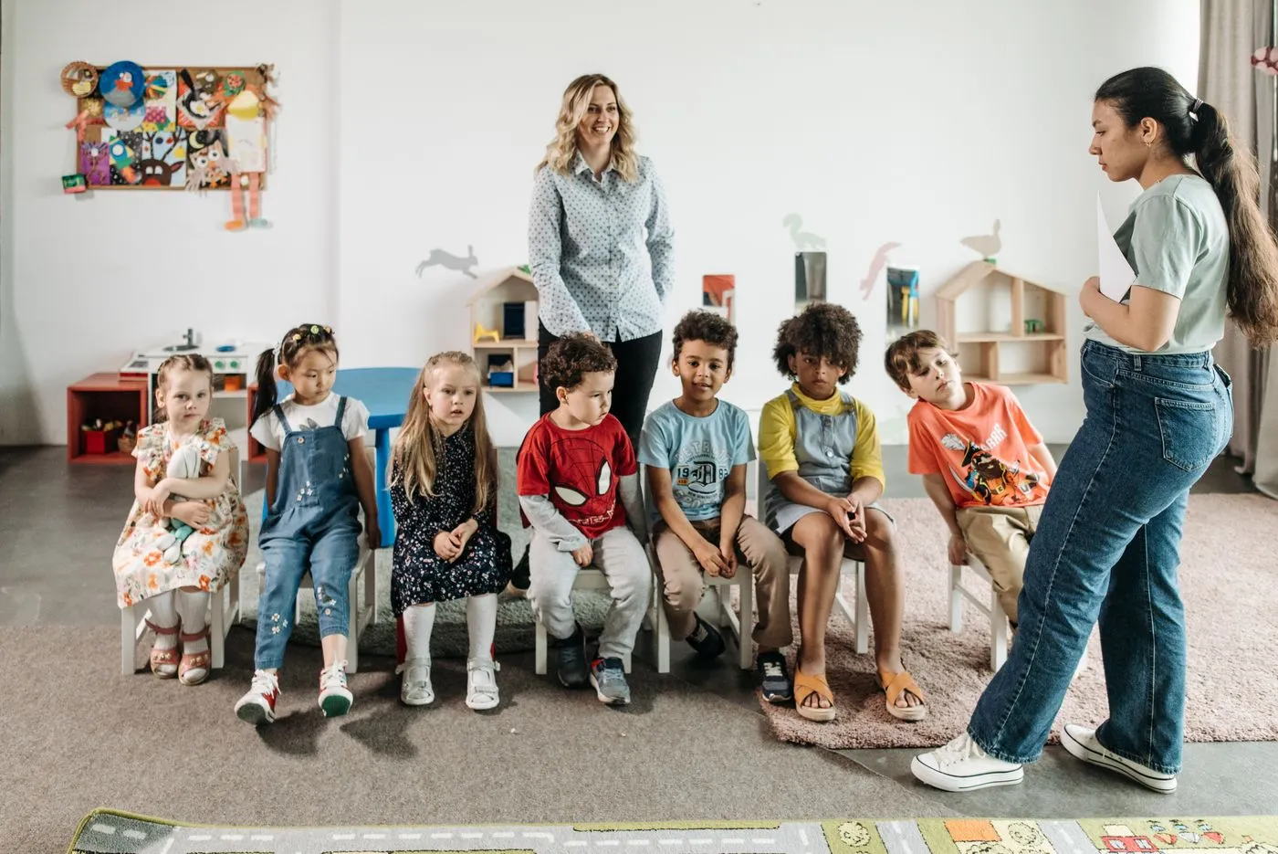 A diverse group of young learners with their teacher