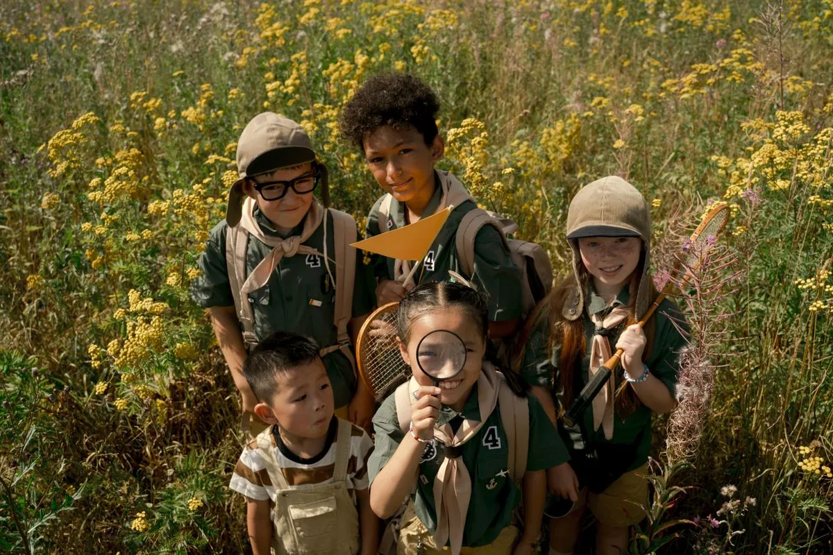 Young explorers discovering nature in a meadow