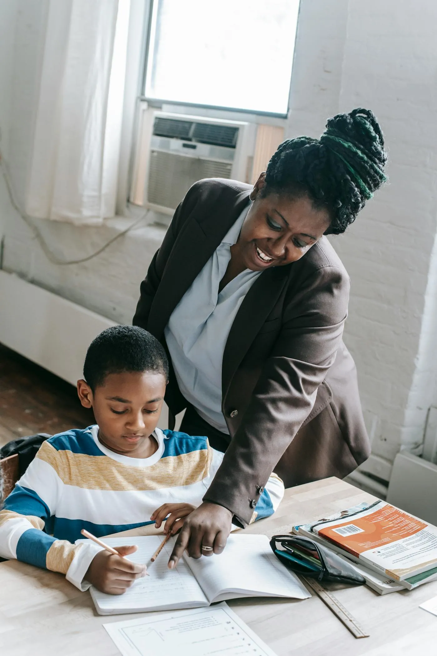 A mentor working one-on-one with a student
