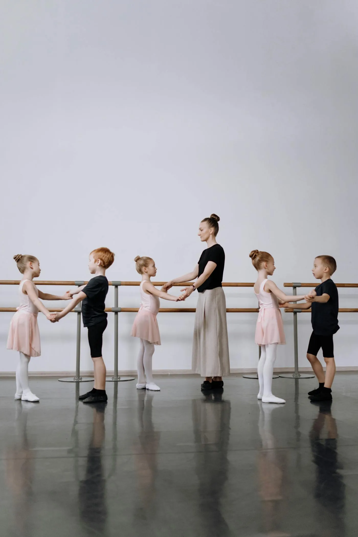 Young dancers learning at the barre