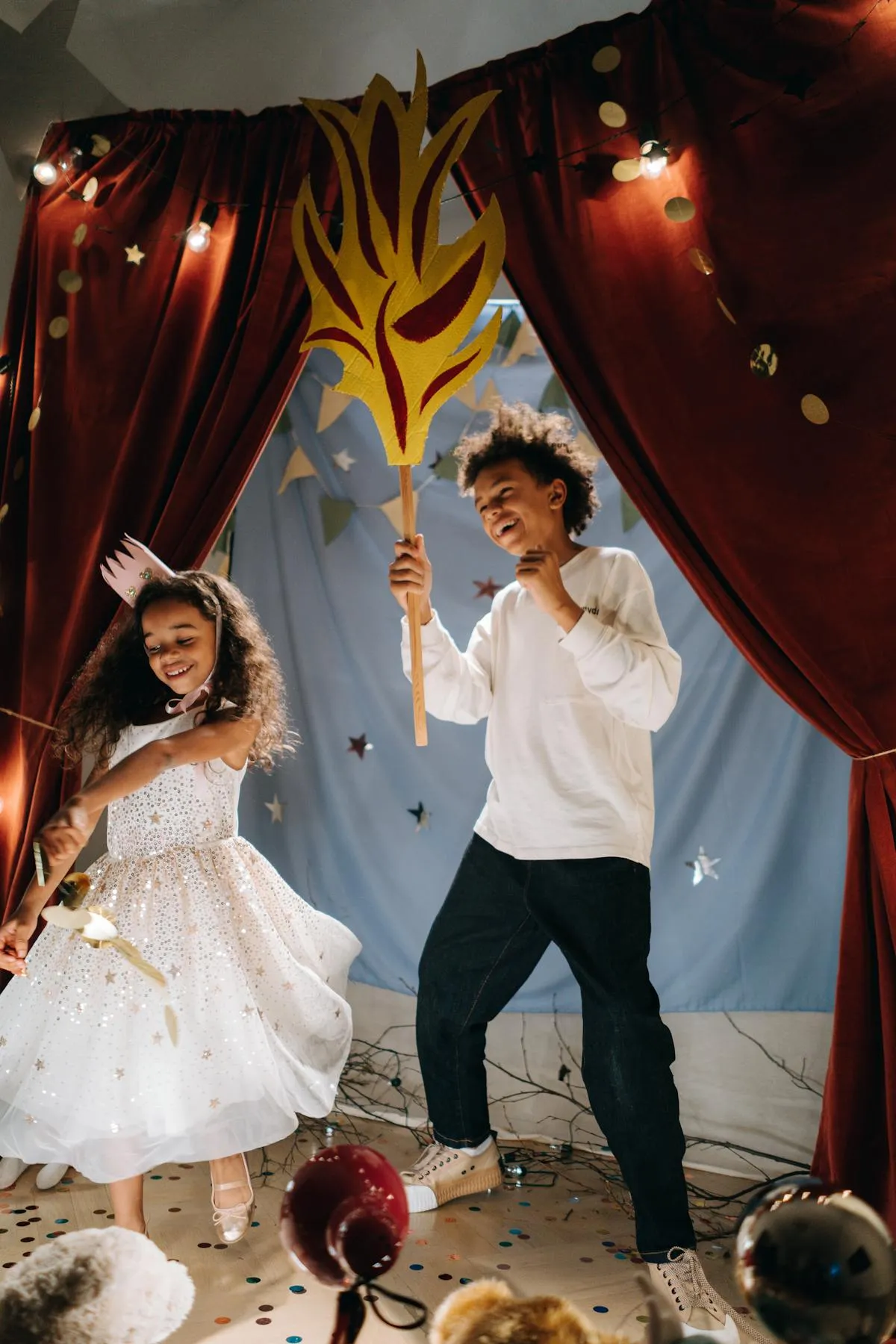 Young performers acting out a play on stage